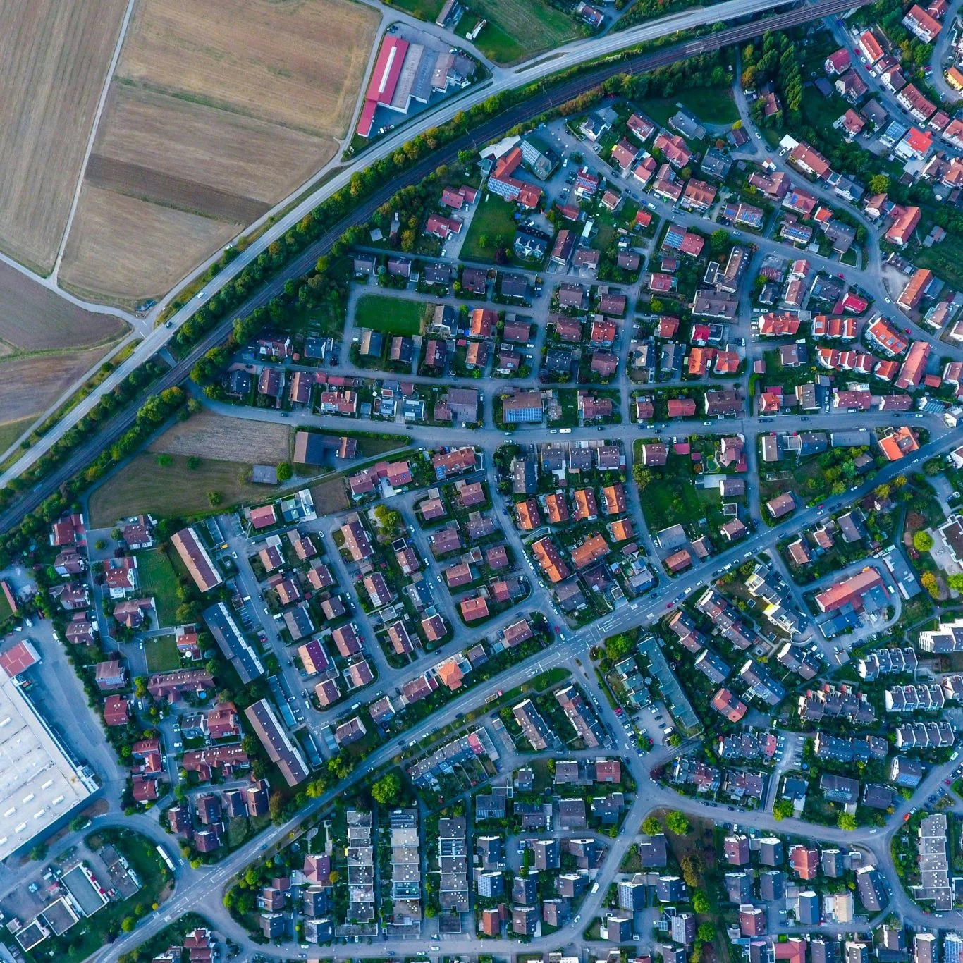 Aerial view of homes, roads and agricultural land